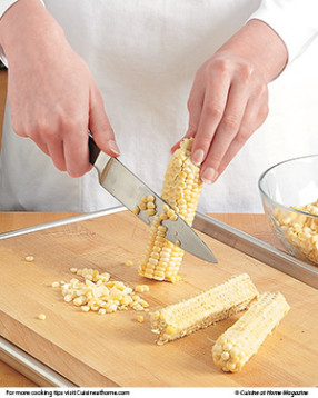 To remove kernels, run a knife down sides of cobs on a cutting board on a baking sheet to catch kernels.