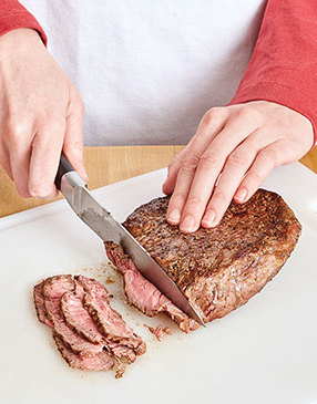 For tenderness and to make it easier to eat, slice the steak as thinly as possible. 