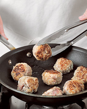 Sear the meatballs in a hot nonstick skillet, turning to brown all sides.