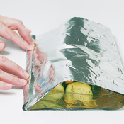 Tightly close the three open sides of the packet using a "double fold"&mdash;fold each seam over twice, firmly creasing to seal.