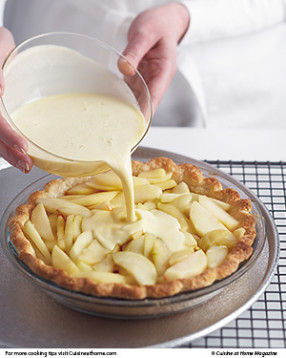 Thoroughly whisk together the egg mixture before pouring it over the apples in the crust.