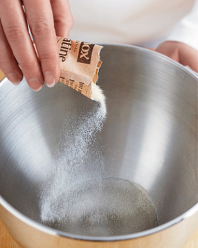 The gelatin will quickly solidify in the water. That's okay. It will melt as you mix in the sugar syrup.