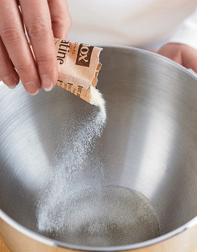 The gelatin will quickly solidify in the water. That's okay. It will melt as you mix in the sugar syrup.