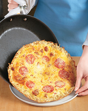 Loosen the frittata's edges with a flexible spatula so it easily slides out of the skillet onto a platter.