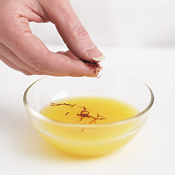 Steeping saffron threads in the orange juice quickly infuses the juice with color and flavor.