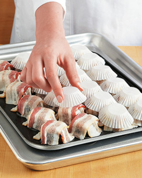 The liners help form the bacon into cups and keep the bacon from sticking to the top baking sheet.