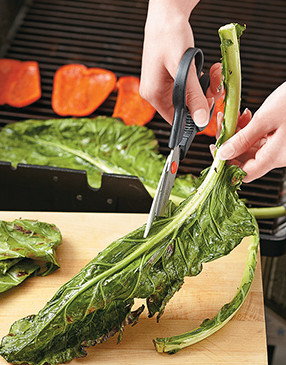 For an easy way to remove the greens from the ribs, use your kitchen shears to cut along the rib. 