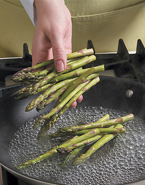 Blanch asparagus in the same skillet. Since it’s already hot, the water will boil almost instantly.