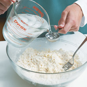 Add a little ice water at a time until dough comes together into a ball.