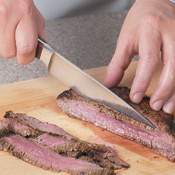 Look at the structure of the steak before cutting, then slice it against the grain.