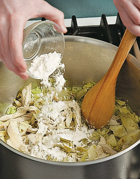 Stir the flour into the vegetables and chicken until coated. The flour will help thicken the soup