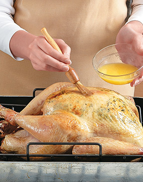 After 2 hours, baste the turkey every 30 minutes to give it color, keeping an eye on the breast.