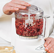 Pulsing berries for the topping in a food processor is fast, but you also can mince them by hand.