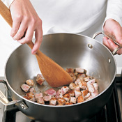 Sear the pork to lock in juices, then remove the pork to a bowl so the meat doesn't dry out in the soup.