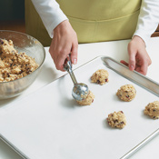 A No. 40 scoop makes quick work of portioning dough into 1 1/2- tablespoon mounds. 