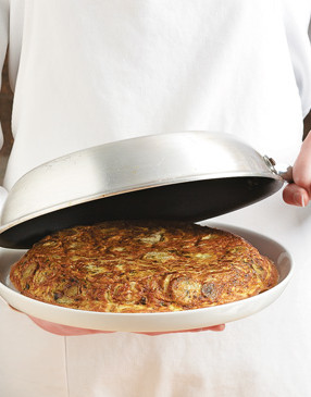 To serve, flip the frittata upside-down onto a spare plate, then flip right-side-up onto serving plate.