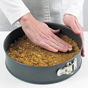 Press the crumb mixture firmly into the bottom and 1 inch up the sides of the springform pan.