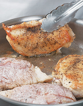 To create a crisp crust on the outside of the chicken, be sure the oil in the pan is hot before adding it.