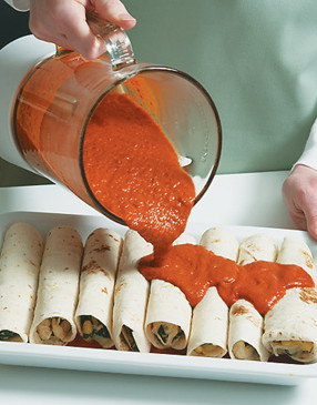 Pour some of the sauce over the top of the enchiladas. Serve remaining sauce on the side.
