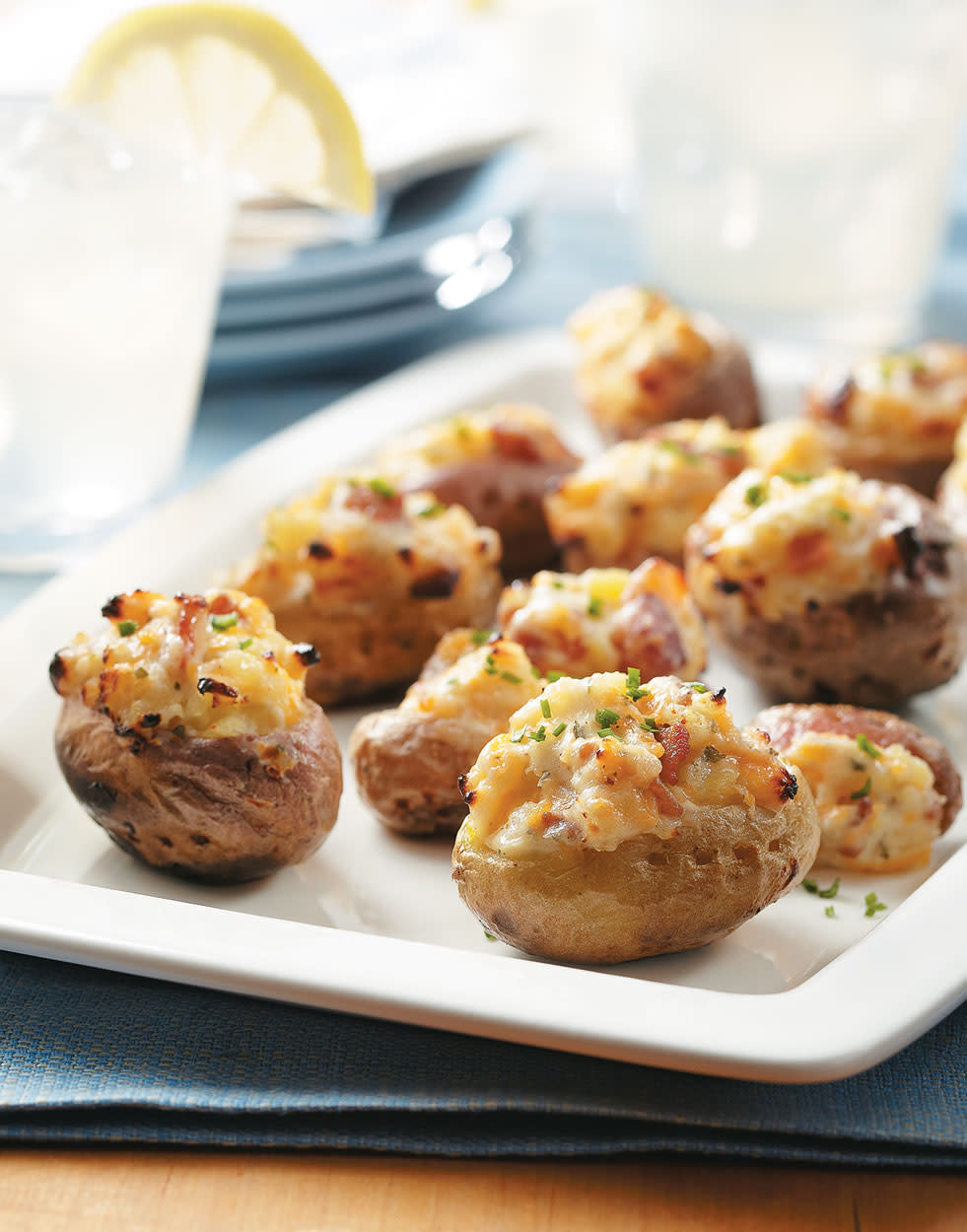 Cheddar, sour cream, ranch and bacon are all stuffed into these bite-sized twice-baked potato poppers. Kids and adults alike will be drawn to these tasty minis. 