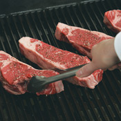 For crosshatch marks, put steaks on the grate with narrow end of steaks pointing toward 10 o'clock. Cover and grill.