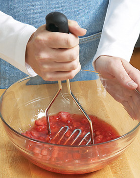 Use a potato masher to lightly crush thawed berries in syrup, then add the fresh strawberries.