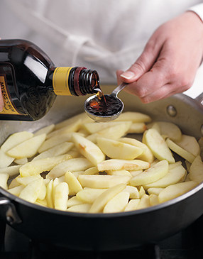 Just a touch of rum adds a delicious flavor to the saut&eacute;ed apples. Apple cider can be substituted.