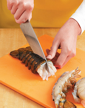 Halved lobster tails cook faster. Split them on a cutting board, cracking through the shell. 