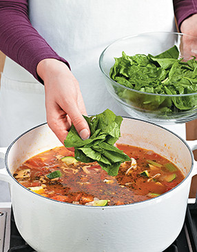 Spinach doesn't need much time to cook, and it wilts quickly, so stir it into the soup just before serving.