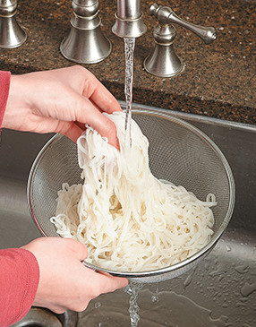 To remove residual starches that cause cooked noodles to stick together, rinse them in cold water.