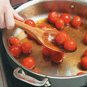 Briefly sauté the cherry tomatoes, then add the sugar and vinegar. Simmer until tomato skins split. 