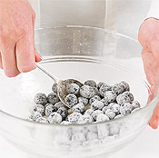 Tossing berries or heavy fruit with sugar and flour prevents these pieces from sinking in the batter.