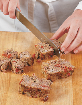 Letting the meatloaf cool to room temperature prevents crumbling, making slicing easier.