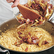 Once the orzo is al dente (cooked but still chewy), stir the precooked vegetables and sausage into it.