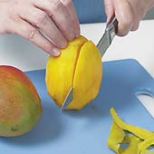 Peel mango with a vegetable peeler, then cut the flesh away from the flat pit and dice.