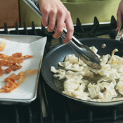 The oil should be very hot when frying the wonton strips. If the oil isn't hot enough, the strips will soak up too much of it. 