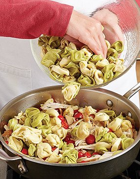 Add the tortellini back to the pan and cook briefly, just so they heat through without overcooking.