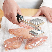 Gently pound chicken pieces with glancing taps until each cutlet is an even thickness.
