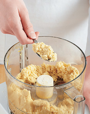 Process the dough for the crust in a food processor until clumps begin to form. 