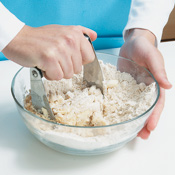 Cut cold butter into flour with a pastry blender until butter is broken down into pea-sized pieces.