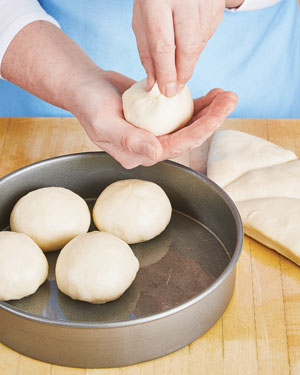 Shaping milk bread dinner rolls