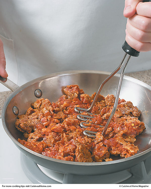 Cook Ground Meat Faster by Using a Potato Masher