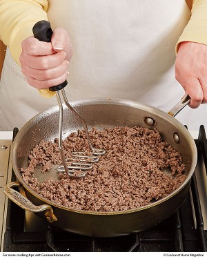 Crushing Meat with a Potato Masher for a Smoother Meat Filling