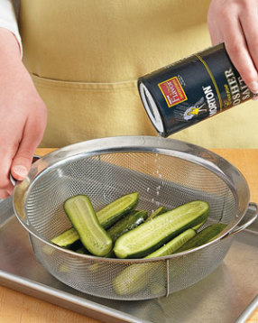 Sprinkling salt over cucumbers draws out natural liquids, allowing more pickling flavor to soak in.