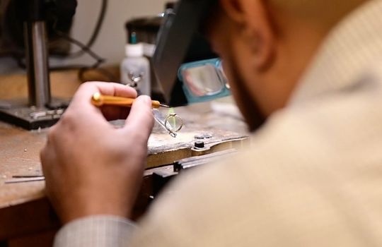 Day's image of someone soldering a ring