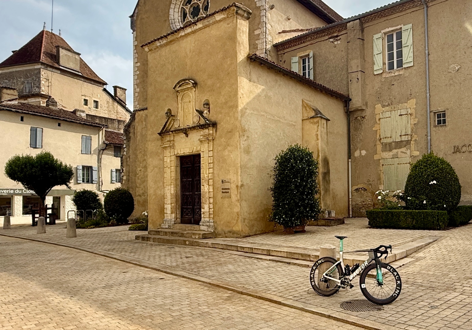 David's ONE in front of a church in the french countryside
