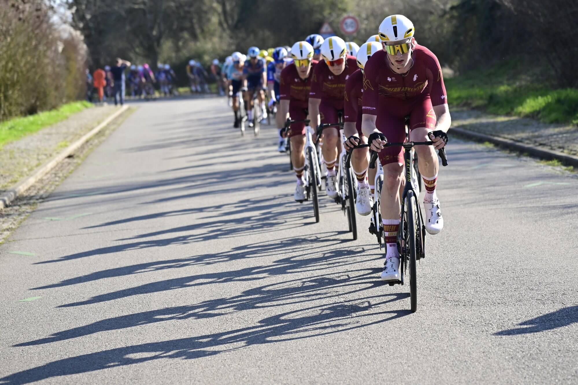 Modern Adventure Pro cycling leading the peloton in a Begian cycling rce