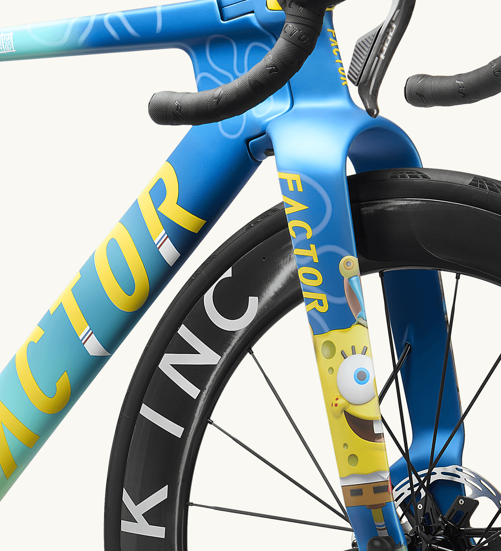 Non-drivetrain side view of the ONE SpongeBob front end including Black Inc wheel, showing the iconic graphic on the fork leg.