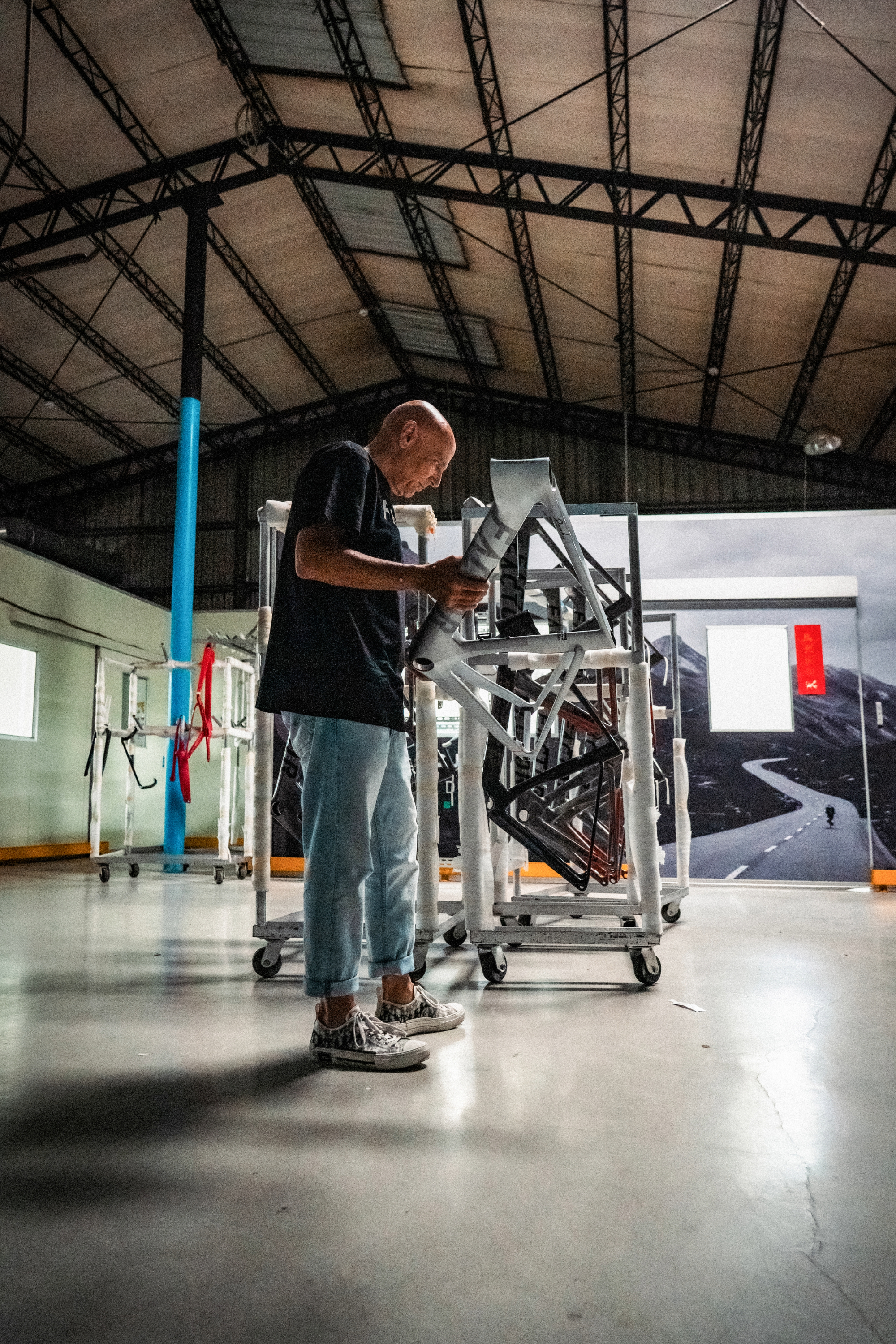 Rob Gitelis inspecting a bike frame 2