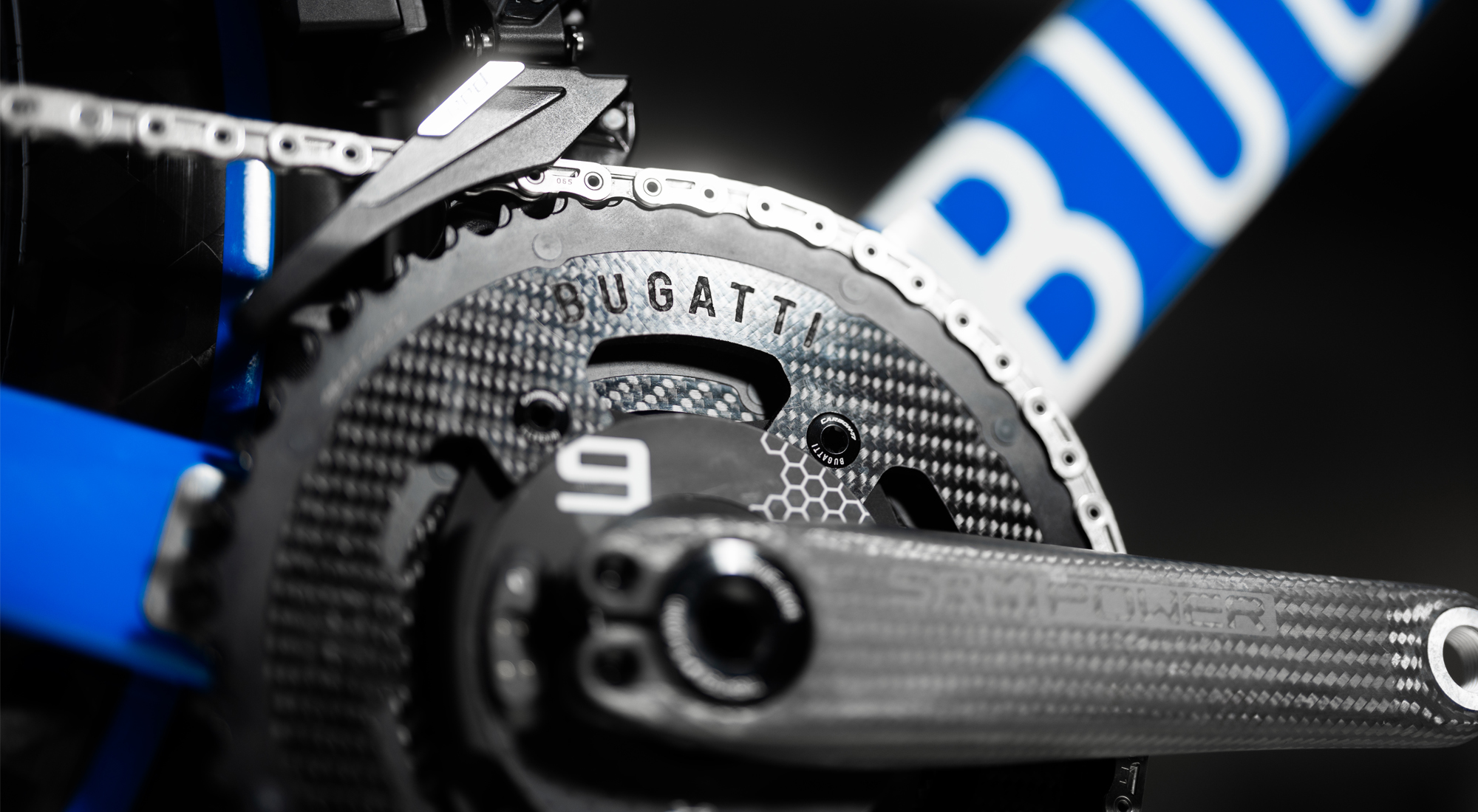 Close-up of the Bugatti-branded carbon chainring attached to the SRM powermeter and THM carbon crank.